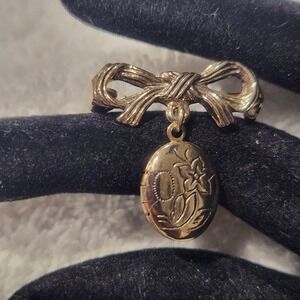 Vintage Gold Tone Bow Brooch with Engraved Floral Oval Dangle Locket Pin